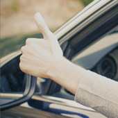 Driving instructor supporting a learner driver