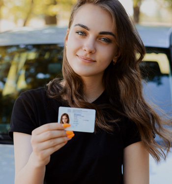 Learner driver celebrating after passing